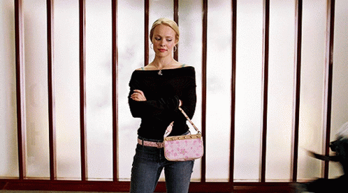 Woman With Arms Crossed Holding Pink Purse GIF