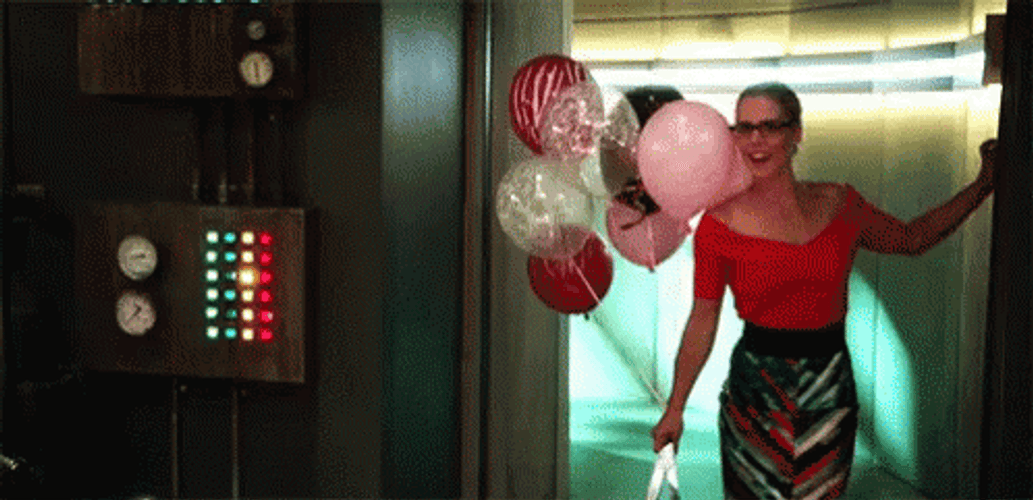 Woman With Balloons Ready To Party GIF