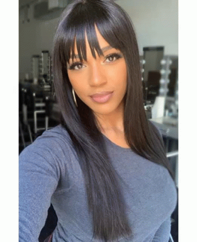 Woman With Bangs And Long Black Hair Taking Selfie GIF