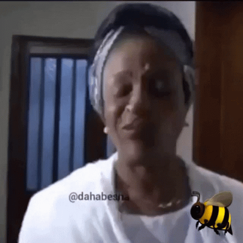 Woman With Bee Behind Saying Dahabesna GIF