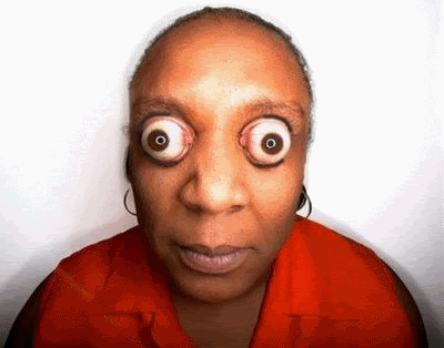 Woman With Big Eyes In Red Shirt GIF
