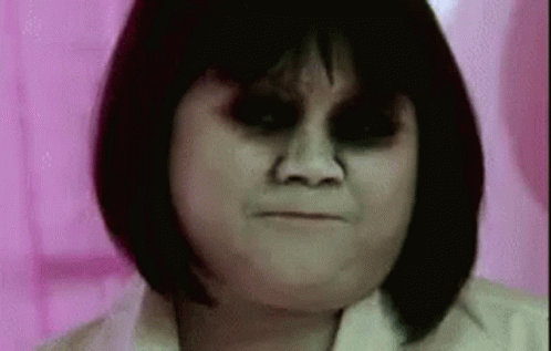 Woman With Black Eyes and Short Hair Close Up