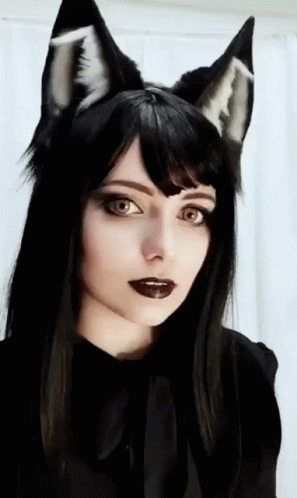 Woman With Black Hair And Cat Ears In Black Shirt GIF