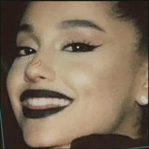 Woman With Black Lipstick and Earrings