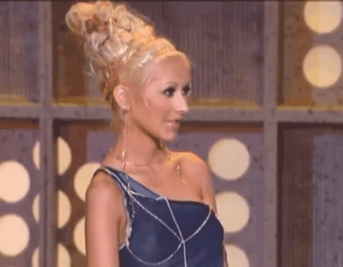 Woman With Blonde Hair And Blue Dress GIF