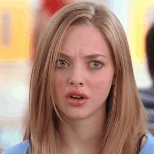 Woman with Blonde Hair and Blue Eyes Surprised