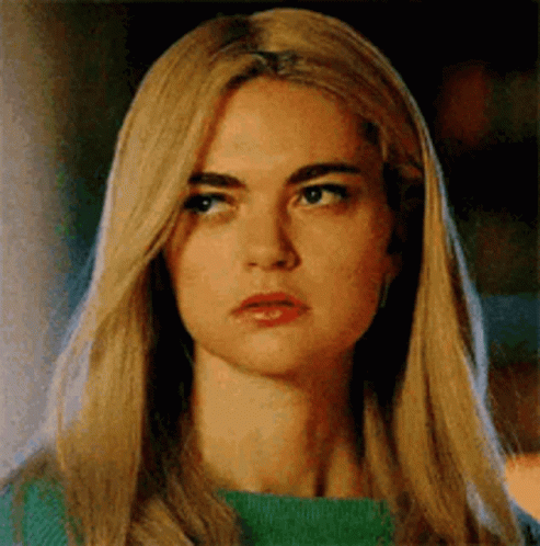 Woman With Blonde Hair and Green Sweater