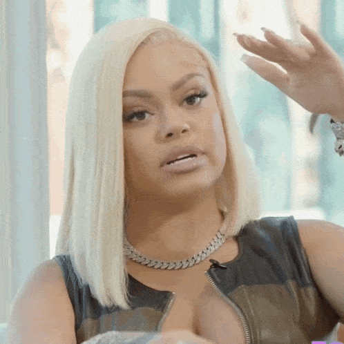 Woman With Blonde Hair And Leather Jacket GIF