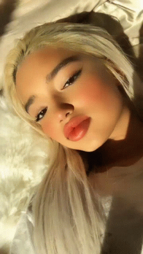 Woman With Blonde Hair and Red Lips Close Up