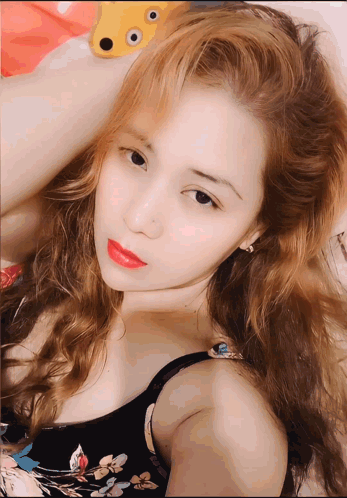 Woman with Blonde Hair and Red Lipstick Lying