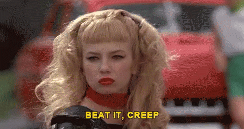 Woman With Blonde Hair And Red Lipstick Saying Beat It Creep GIF
