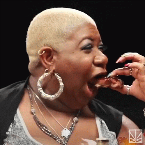 Woman With Blonde Hair Eating Food
