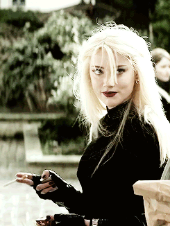 Woman With Blonde Hair In Black Top GIF