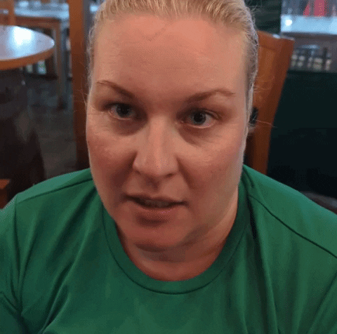 Woman With Blonde Hair In Green Shirt GIF