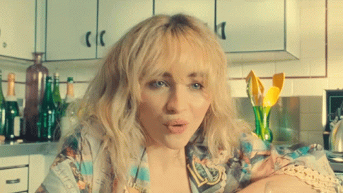 Woman with Blonde Hair in Kitchen