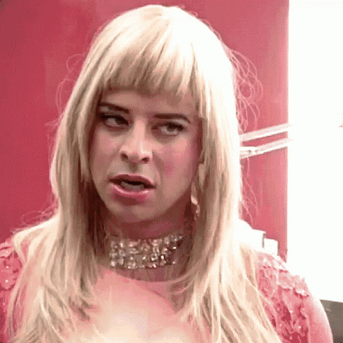Woman With Blonde Hair In Pink Dress GIF