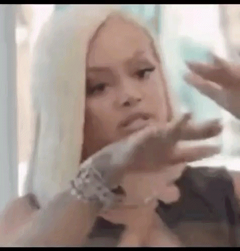 Woman With Blonde Hair Making Face GIF