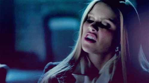 Woman With Blonde Hair Making Funny Face GIF