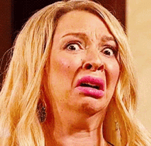 Woman With Blonde Hair Making Funny Face GIF