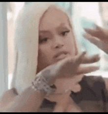 Woman With Blonde Hair Making Funny Face GIF