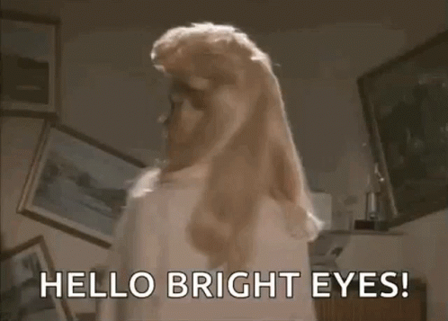 Woman With Blonde Hair Saying Hello Bright Eyes