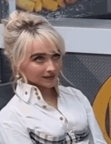 Woman with Blonde Hair Sitting