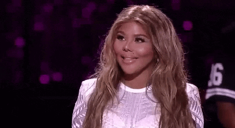Woman With Blonde Hair Smiling On Stage GIF