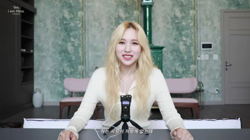 Woman With Blonde Hair Smiling Wearing Headphones GIF
