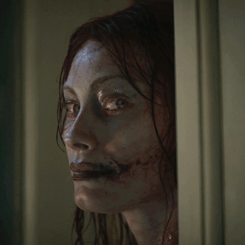 Woman With Blood on Face Smiling