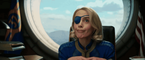 Woman With Blue Eye Patch Looking Out Window
