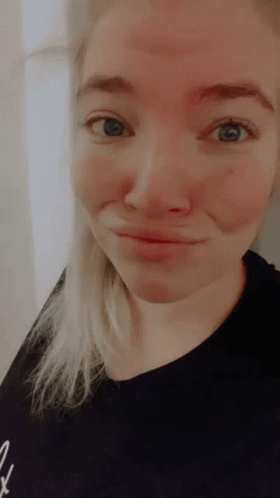 Woman With Blue Eyes and Black Shirt