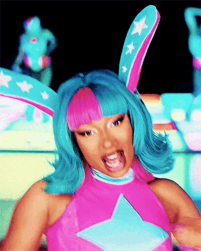 Woman With Blue Hair And Bunny Ears In Pink Star Top GIF