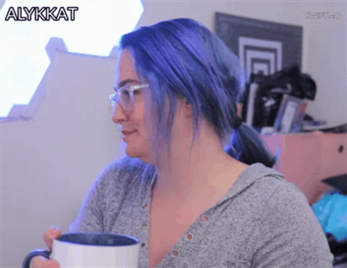 Woman With Blue Hair and Glasses Holding Coffee Alykkat