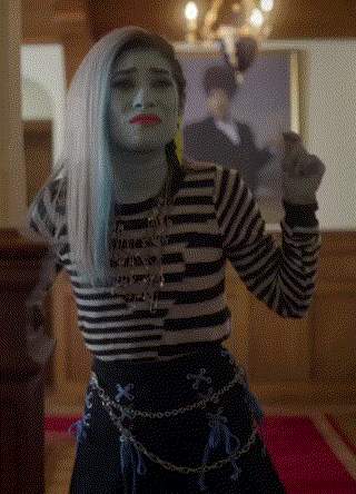 Woman With Blue Hair And Striped Shirt Before Man Portrait GIF