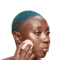 Woman With Blue Hair Applying Makeup With Pink Sponge