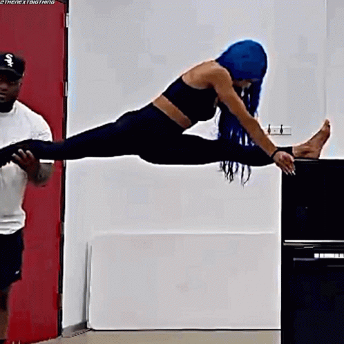 Woman With Blue Hair Doing Split GIF