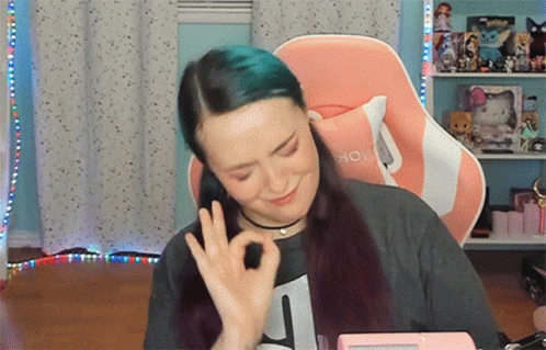 Woman with Blue Hair Giving Ok Sign
