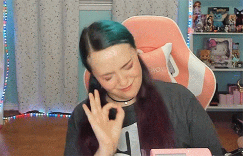Woman with Blue Hair Giving Ok Sign