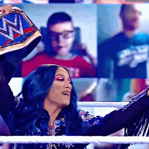 Woman With Blue Hair Holding Wrestling Belt