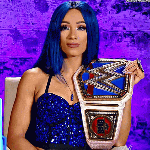 Woman with Blue Hair Holding Wrestling Belt