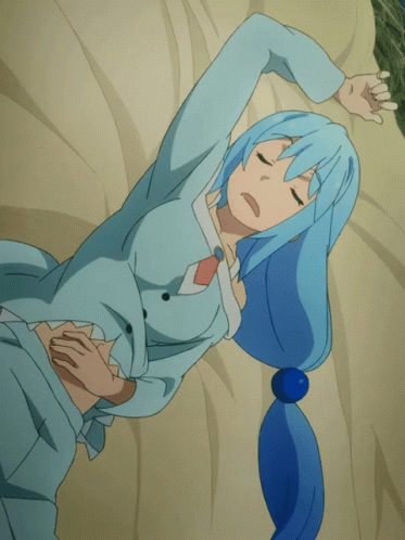 Woman With Blue Hair Laying On Bed Eyes Closed GIF