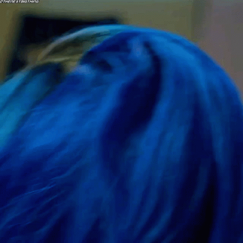 Woman With Blue Hair Looking Down GIF