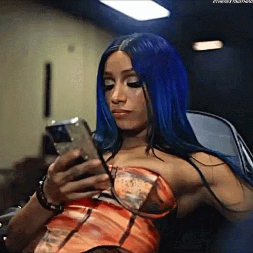 Woman With Blue Hair Using Cell Phone