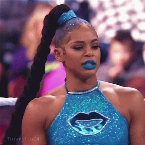 Woman With Blue Lipstick Ponytail Blue Top With Mouth