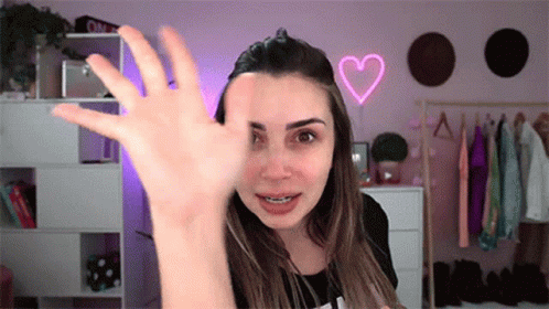 Woman With Braces Waving GIF