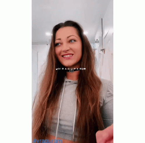 Woman With Braces Wearing Grey Crop Top GIF