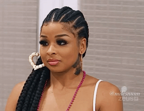 Woman With Braided Hair and Heart Hoop Earring and Neck Tattoo