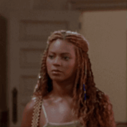Woman With Braided Hair Looking Surprised