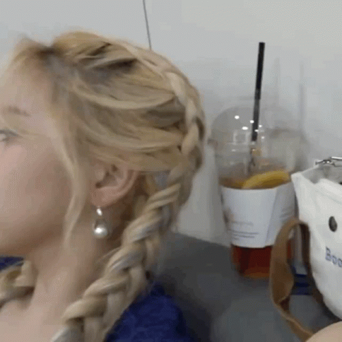Woman With Braided Hair Next To Coffee GIF