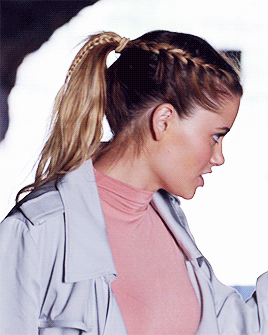 Woman With Braided Ponytail In Pink Shirt GIF